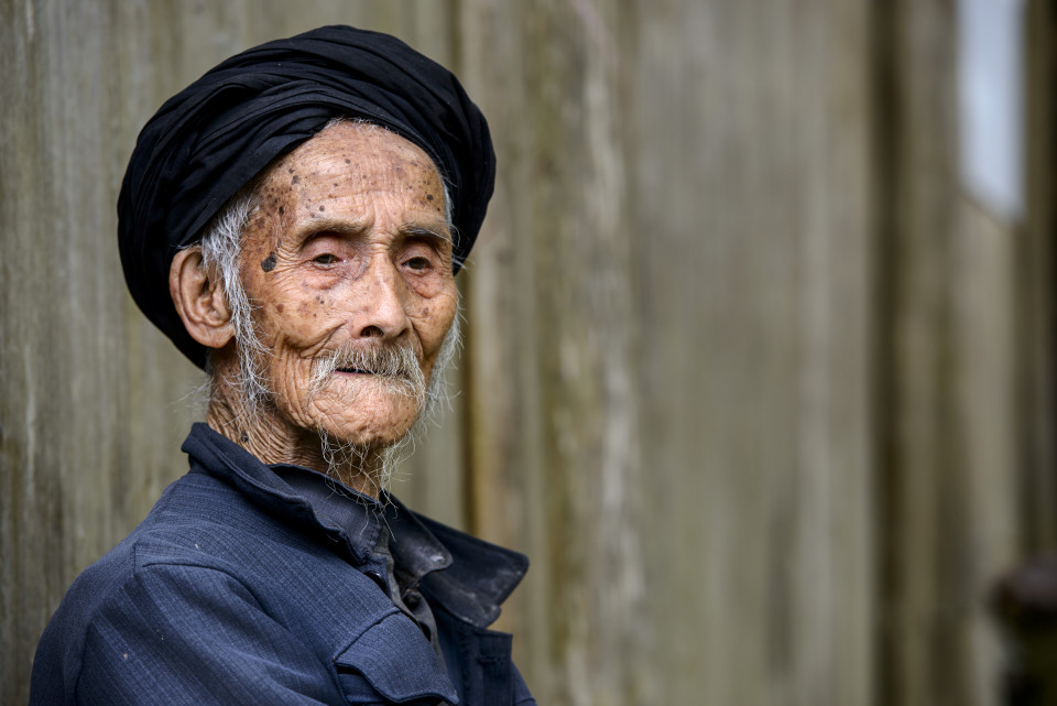An elderly member of the Yao minority people in Tiantou Village, Guangxi, China.
